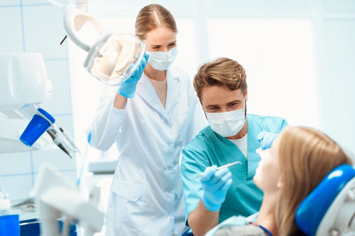 Benefits of cosmetic dentistry Antalya,Turkey 2 dentist examining patients mount with a dental equipments in dental clinic room Turkey