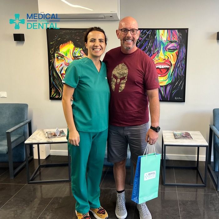 dentist have photo with patient after gum contouring operation